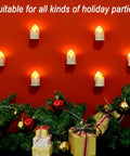 Rechargeable Flameless LED Tea Lights With Remote And Timer Waterproof Battery Operated Votive Candles displayed on red wall with gifts