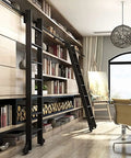 Top Shelf Sliding Barn Door Hardware Kit With Steel Round Tube Ladder Rail and Heavy Duty Floor Casters No Sweat Install Track System showing a black ladder on shelves.
