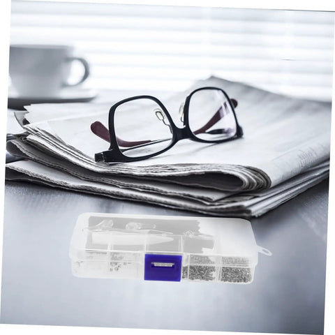 Image of eyeglasses on a stack of newspapers with an Eyeglass Repair Tools Kit With Screws Nose Pads And Tiny Screwdriver in the foreground.