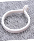 Single white ring from 60 Pack Plastic Curtain Rings For Rods Thick Durable Construction With Smooth Glide For Heavy Curtains Easy Install