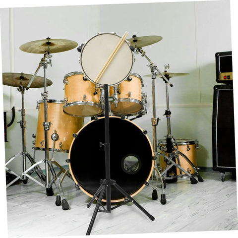 Slick Folding Snare Drum Stand With Adjustable Height Tripod Design Hella Stable Alloy Build; showcasing a snare on a stand in a drum setup.