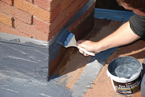 Application of Brushable Black Elastomeric Chimney Flashing Sealant For Waterproof Leak Protection Around Chimneys, Vents And Skylights.
