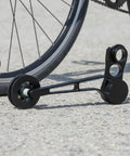 Rear Derailleur Chain Tensioner With 11T Pulley For Folding Bikes delivers no sweat shifting, black aluminum design on a concrete surface.