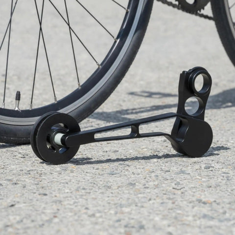 Rear Derailleur Chain Tensioner With 11T Pulley For Folding Bikes delivers no sweat shifting, black aluminum design on a concrete surface.