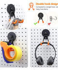 Heavy Duty Magnetic Hook Set Three Pack with Double Hanging Design for Garage Tools and Hoses 2.6 Inch Industrial Utility Hangers with hammer, tape, and headphones hanging on pegboard