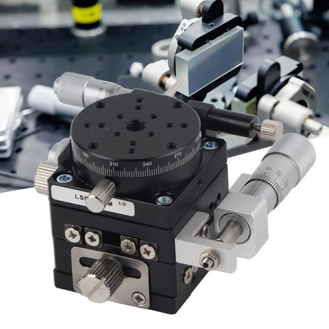 Close-up of Three Axis Manual Linear Stage 40x40mm with fine adjustment knobs in optical lab setup.