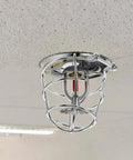 Heavy Duty Fire Sprinkler Head Covers 2 Pack Tool Free Impact Blocker For Vandalism mounted on smooth ceiling.