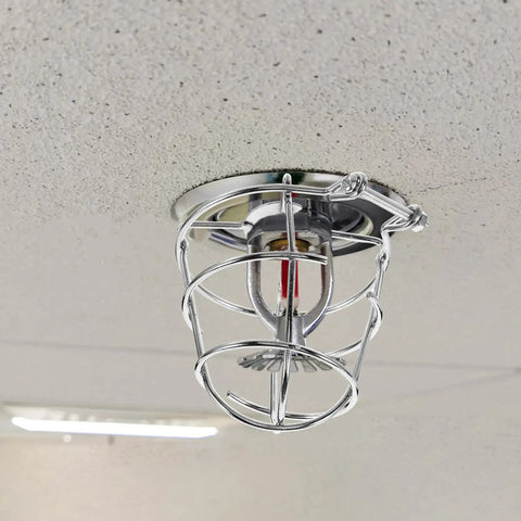 Heavy Duty Fire Sprinkler Head Covers 2 Pack Tool Free Impact Blocker For Vandalism mounted on smooth ceiling.