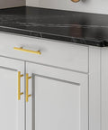 Brushed Brass Cabinet Handles With 3-3/4 Inch Hole Spacing, Stainless Steel Drawer Pulls For Cabinets, Kitchen, Bathroom, And Dresser, Rust Resistant, 5 Pack By Home Edit installed on drawers in a kitchen
