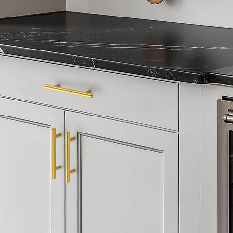 Brushed Brass Cabinet Handles With 3-3/4 Inch Hole Spacing, Stainless Steel Drawer Pulls For Cabinets, Kitchen, Bathroom, And Dresser, Rust Resistant, 5 Pack By Home Edit installed on drawers in a kitchen