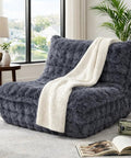 Faux Fur Memory Foam Bean Bag Chair With Filler, Ultra Soft Chill Fireside Lazy Sofa For Bedroom, Living Room, Office And Home, Dark Grey Cozy Seating with white throw in a room.