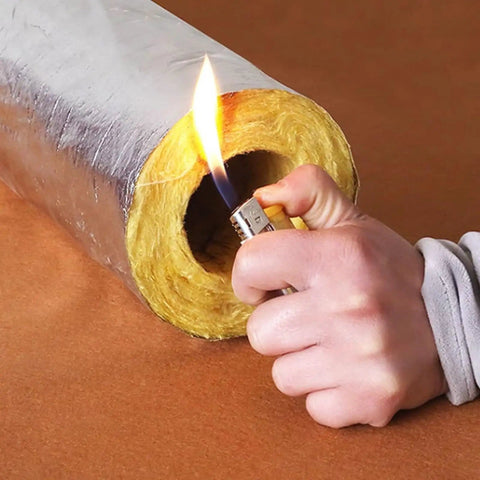 Person testing flame resistance of Heavy Duty Rock Wool Pipe Shell High Temperature Insulation for Steam Boiler Pipes