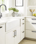 Modern kitchen with Overton Two Tone Cabinet Pull in Brushed Matte Black and Brushed Gold, 8-13/16 Inch Center to Center installed on drawers.