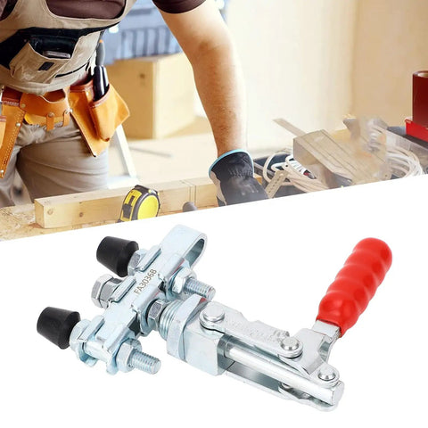 Double Head Push Pull Toggle Clamp Securely Locks Welding, Saws And Molds For Rock Solid Build Quality And Quick Release Clamping Action On Any Shop Job close-up with red handle and rubber heads.