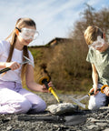 Children using Heavy Duty 26oz Rockhounding Kit With 12-Inch Folding Multitool Shovel Survival Bracelet Safety Glasses Jewelers Loupe Gloves For Prospecting Gold Mining Stone Breaking Pry Rocks And Loosen Soil outdoors.