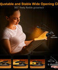 Gritin rechargeable clip-on book light clipped to a book; flexible goose-neck for warm eye-care illumination.