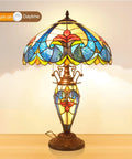 Retro Tiffany Style Table Lamp with Stained Glass, 24 Inches Tall, orange glow, on a wooden surface, daytime setting