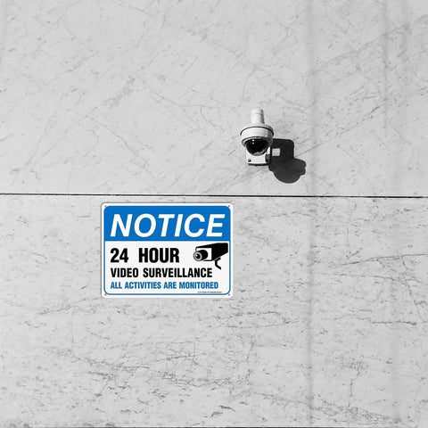 Heavy Duty Video Surveillance Sign 4 Pack 7x10 Inch Reflective Aluminum Security Camera Warning Decal mounted on wall