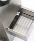 Close-up of the stainless steel collection drawer from the automatic deep fryer oil filter for busy restaurants.