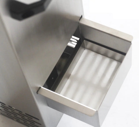 Close-up of the stainless steel collection drawer from the automatic deep fryer oil filter for busy restaurants.