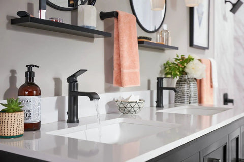 Genta LX Modern 6.8 Inch Matte Black Towel Bar in a chic bathroom setting, coordinating with matte black faucets.