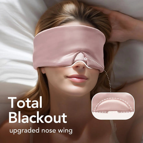 Woman wearing 100 Percent Mulberry Silk Sleep Mask For Women Adjustable Comfort Side Sleeper Friendly Full Blackout Eye Cover For All Night Sleep Travel Office Or Naps Pink