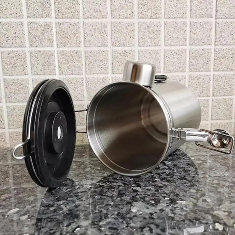 Rock Solid 304 Stainless Steel Coffee Canister Featuring One Way Degassing Valve And Rotatable Date Tracker lying on a granite countertop.