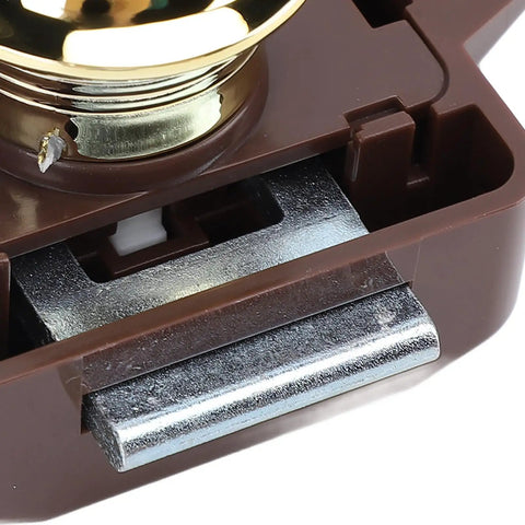 Close-up view of Cabinet Push Button Latch Keyless Cupboard Lock with smooth finish, brown base, and gold color.
