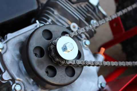 Clutch Bolt Kit for Predator Engines With Heavy Duty Washer And Lock Washer, installed on go-kart engine with visible chain drive.