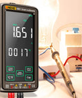 All In One Digital Multimeter With NCV Tester 6000 Counts Large VA Reverse Display Data Hold Handy Ammeter Readouts Rechargeable Universal Meter For DIYers And Pros showing live measurement display in use with probes connected to circuitry.