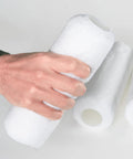 Heavy-Duty 9 Inch Microfiber Woven Paint Roller Covers With A Snug 3/4 Inch Nap, held in hand, showcasing smooth texture for easy painting.