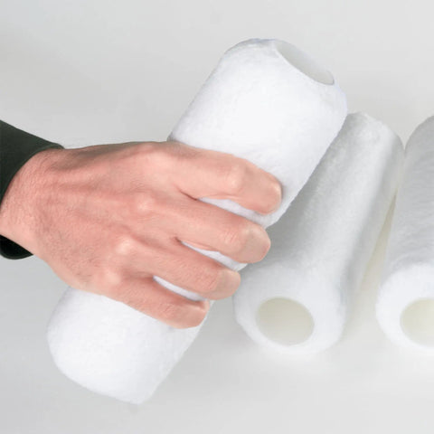 Heavy-Duty 9 Inch Microfiber Woven Paint Roller Covers With A Snug 3/4 Inch Nap, held in hand, showcasing smooth texture for easy painting.