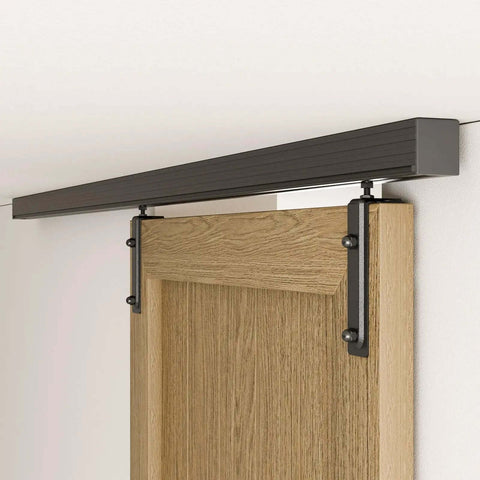 6.6 Foot Ceiling Mount Box Rail Barn Door Hardware Kit installed with wooden door, showing black powder-coated finish and nylon rail hangers.