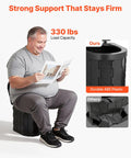 Man sitting on Grab And Go Portable Camping Toilet Kit With Pop Up Privacy Tent showing 330 lb load capacity.