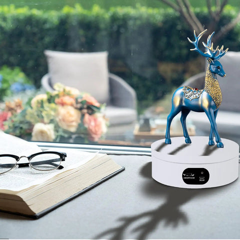 Badass Electric Powered 360 Motorized Tumbler Display Stand with blue deer figurine, white base, and steady rotation for displays.