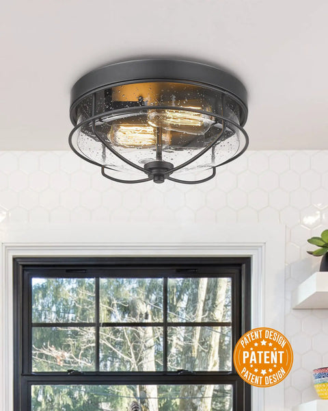 12 Inch 2 Light Farmhouse Flush Mount Ceiling Light With Seeded Glass Shade In Sand Black Finish in a kitchen setting