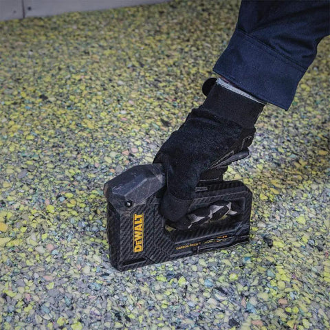 Carbon Fiber Body Workhorse 2 In 1 Staple Gun Tacker for Heavy Duty Staples and 18 Gauge Brads in use on upholstery.