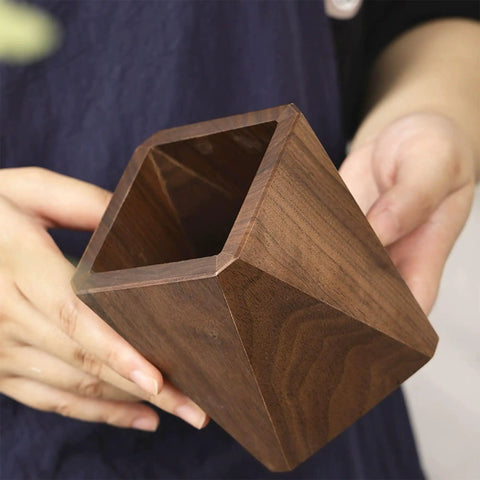 Walnut Diamond Shaped Wooden Pencil Holder Desk Cup With Big Capacity And Smooth Wax Finish displayed in hand