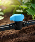Close-up of a blue inline valve from 12 Pack Half Inch Drip Irrigation Shut Off Valves Inline Ball Valve For One Half Inch Tubing