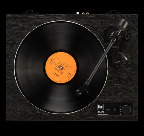Dual CS429 Fully Automatic Belt Drive Turntable In Sleek Black with orange vinyl record in view, showcasing precise alignment and engineering.