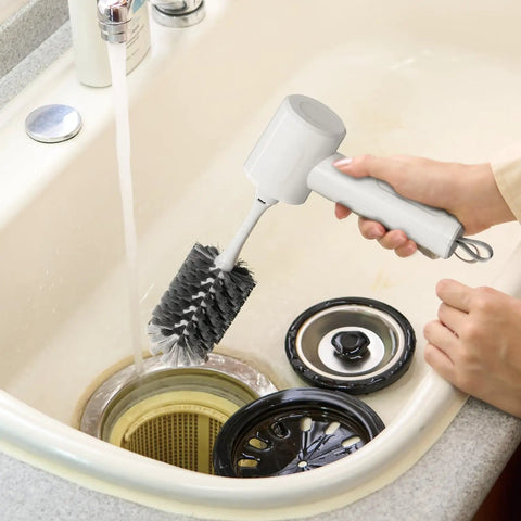 Using Cordless Electric Spin Scrubber With 1500mAh Battery in sink for cleaning kitchen items, showcasing brush functionality.