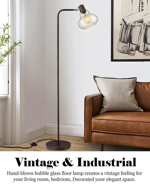 Farmhouse Bubble Glass Floor Lamp With Adjustable Tall Pole in living room next to sofa, Edison bulb glowing, oil rubbed bronze finish