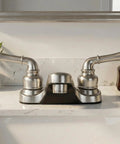 Two Lever Bathroom Sink Faucet With Elegant Arc Spout In Brushed Satin Nickel Finish Built To Last Aerated Water Stream For Splash Free Use Metal Plating Over Lightweight ABS Construction Classic Style For Everyday Bathrooms