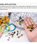 10 Sets Of 9mm Leather Cord End Caps With Lobster Claw Clasps Barrel Terminators For DIY Jewelry Making displayed on hand.