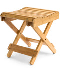 Foldable Shower Stool For Tiny Bathrooms Bamboo Foot Rest And Shaving Stool Space Saver Portable Folding Shower Bench Inside Shower Wooden Sauna Chair For Homes And RVs, shown in natural bamboo wood with slatted top and foldable legs.