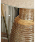 Close-up of Casual 30 Inch Ceramic Table Lamp With Ribbed Texture In Terracotta Taupe And Brown Finish Elegant Lighting base