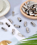 50 Pack Stainless Steel Arrow Field Tips 8mm Glue On Points For Target Practice displayed in a wooden bowl.