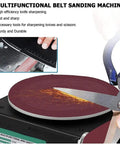 Kickass Heavy Duty Mini Belt Sander With Three In One Grinding And Polishing Kit Featuring 150mm Disc And Seven Speeds Up To 8000 Rpm knife sharpening in action.