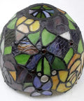 Close-up of colorful Tiffany-Style Red Rose Stained Glass Table Lamp shade, featuring intricate pattern and vibrant hues.