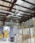 Industrial Grade 24 Ft HVLS Ceiling Fan With Built In VFD Brushless Motor And Remote Control in a warehouse setting.